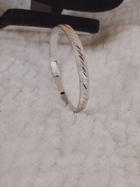 Monet Silver-Tone Faceted Cut Bangle Bracelet